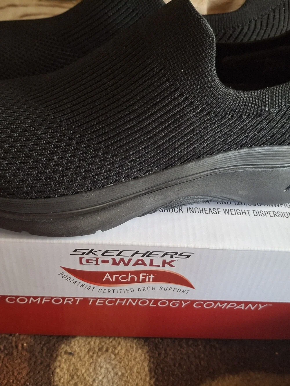 Skechers Arch Fit Slip-On Knit Sneakers in Black
